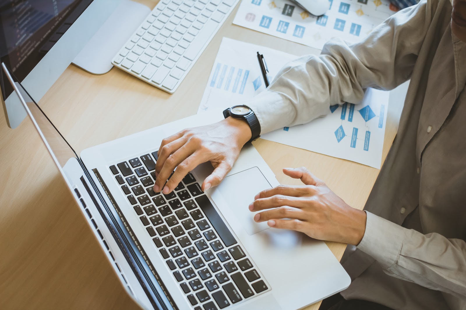 Business introduction email sample: Person using a laptop on a desk